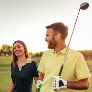 Group of friends walking on the golf course
